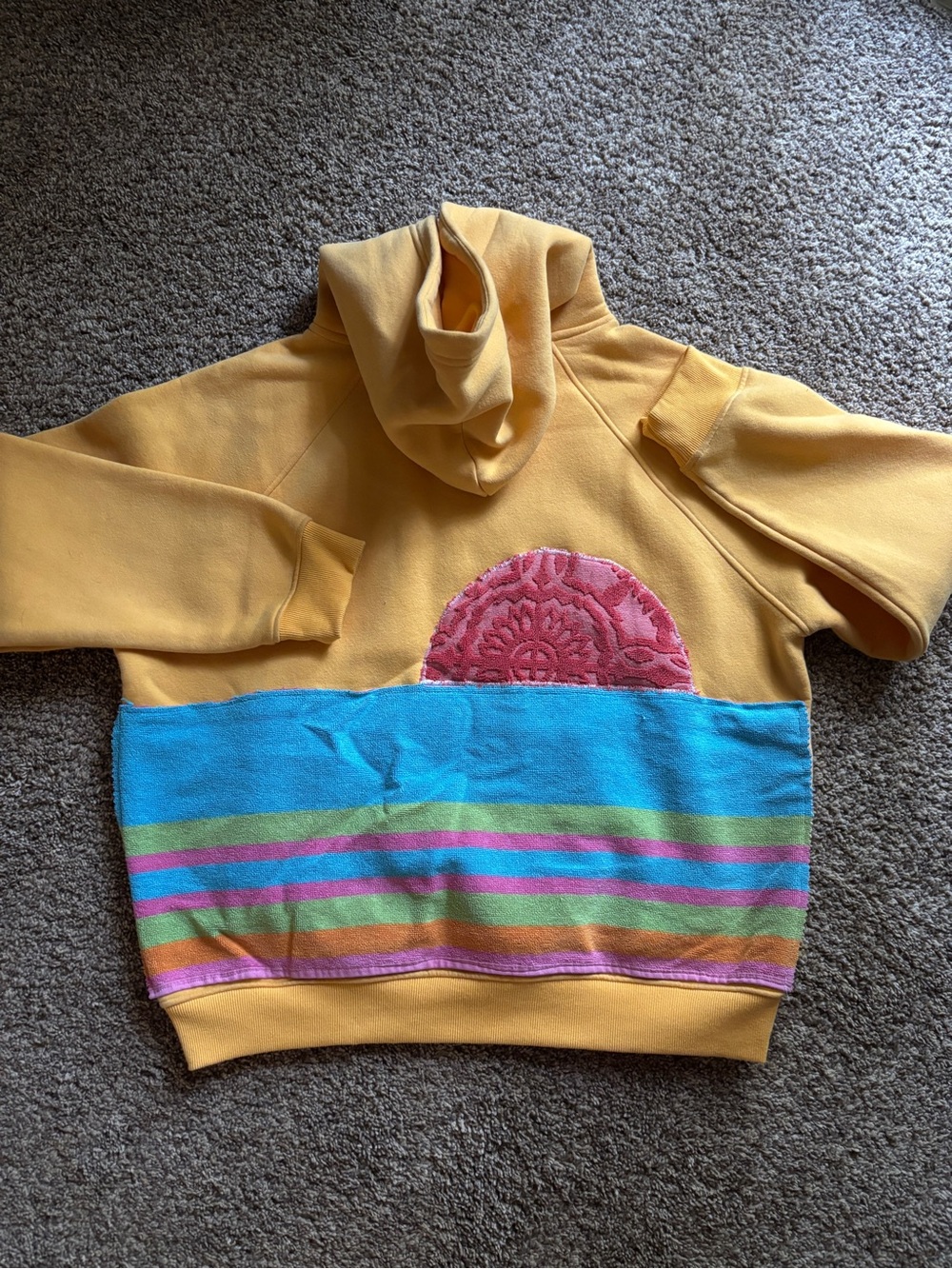 Upcycled hoodie with vintage beach towel appliqué